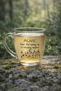 Alive but thriving is a strong word glass mug | engraved tapered mug